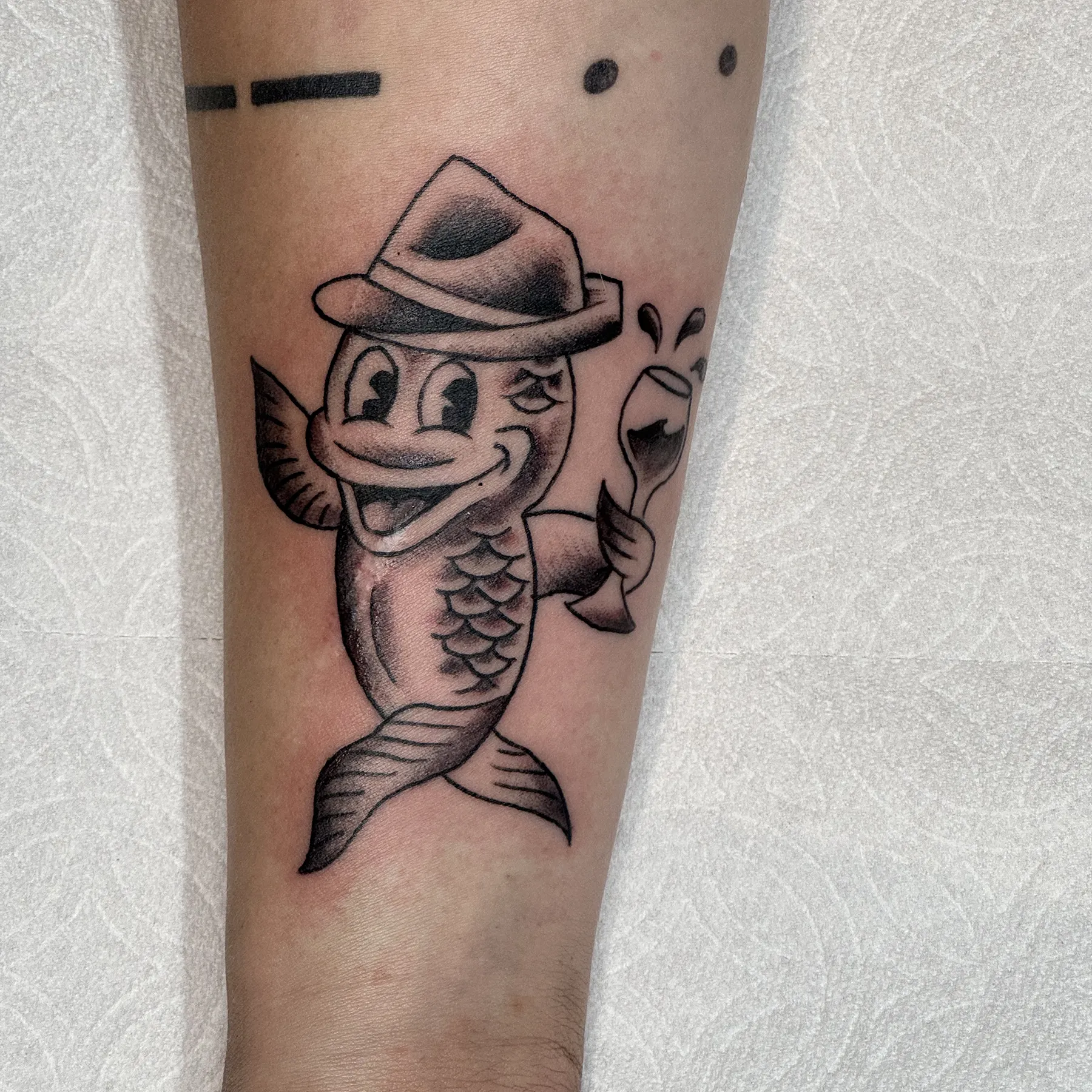 Sardine tattoo, black and gray