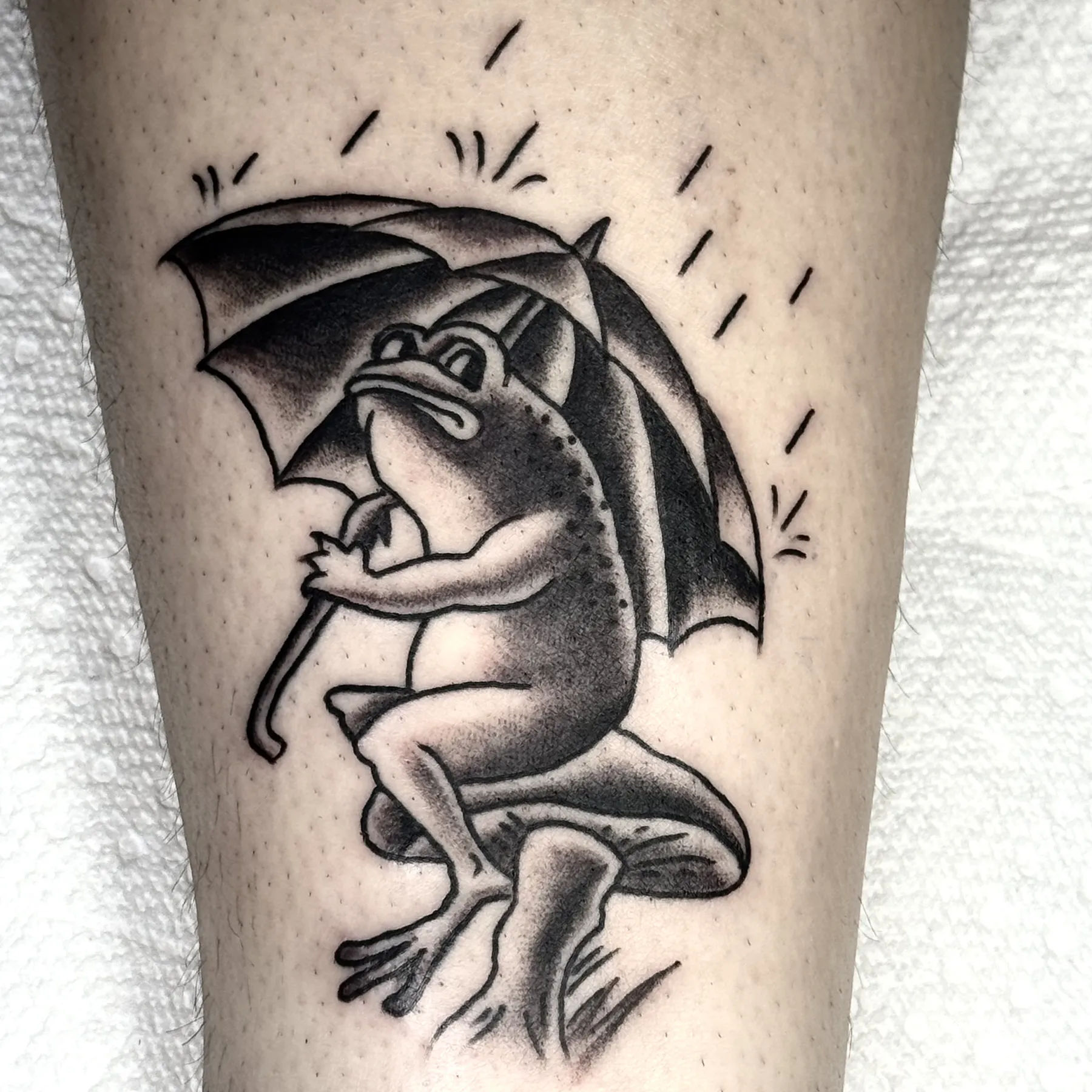 Black and gray frog tattoo